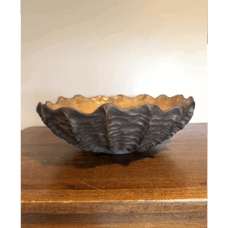 Black seashell bowl with gold interior